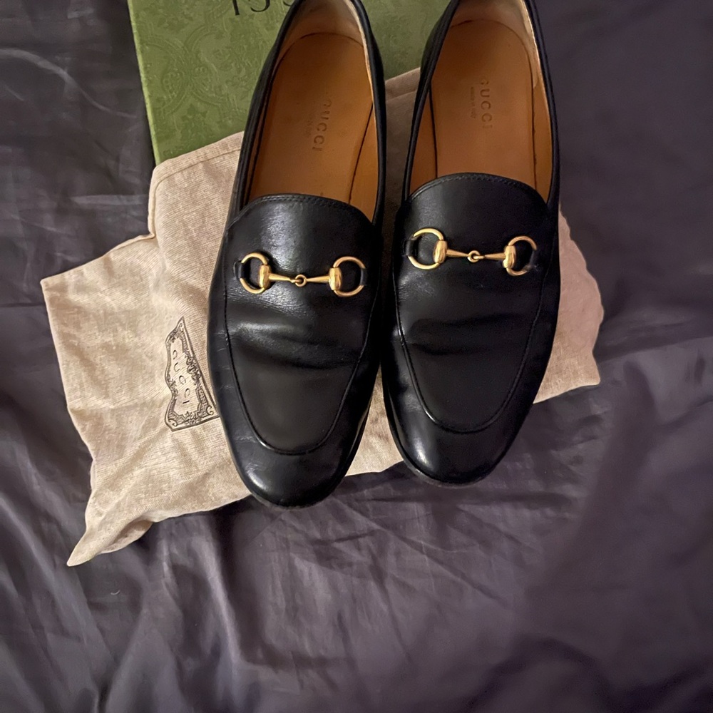 Gucci women’s Black Leather Loafers with Gold Hardware
